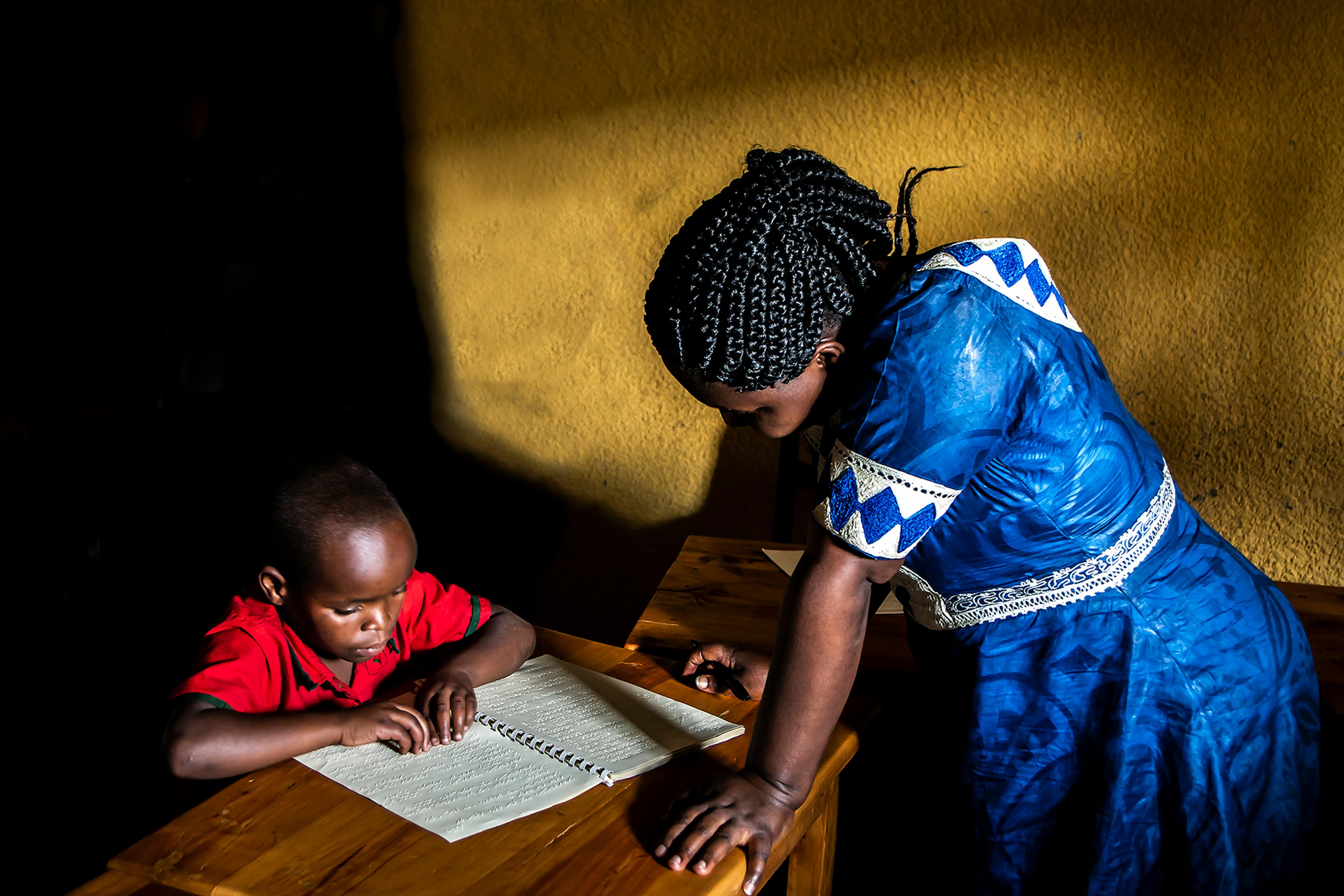 Community members supporting education in Africa